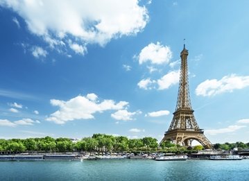 Eiffel Tower with river in the foreground