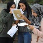 3 female students reading their results