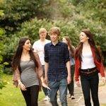 groups of students walking through park